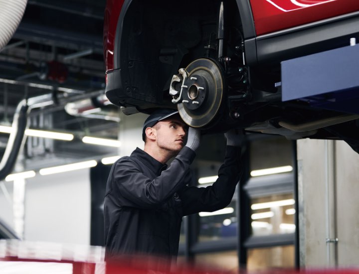 Technician pouring Oil